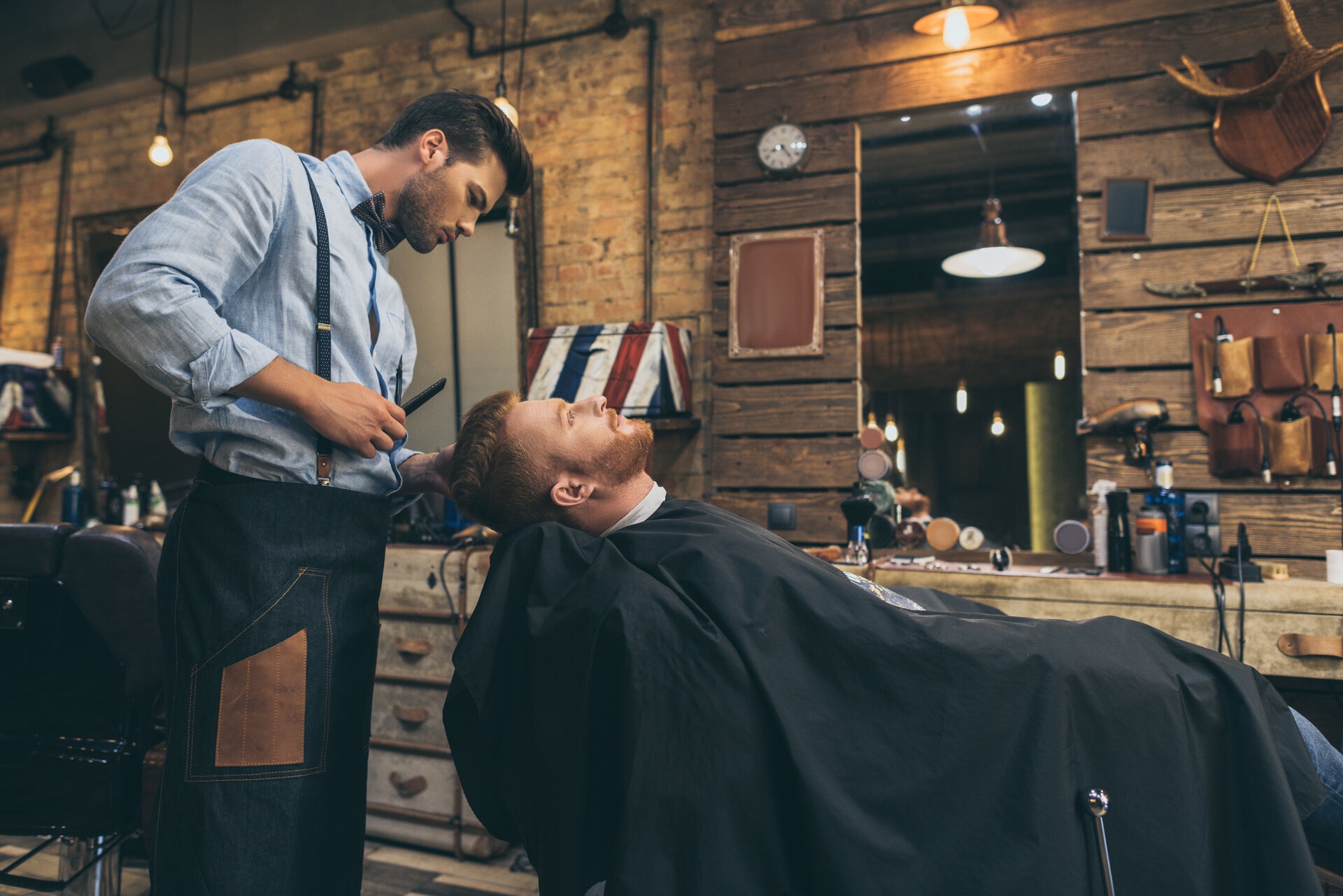 Apex barber cutting a client's hair in the shop
